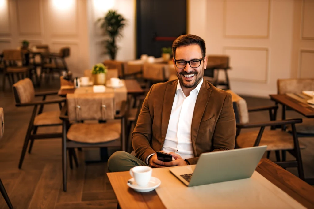 Entrepreneur using guest Wi-Fi and viewing a captive portal in a cafe.