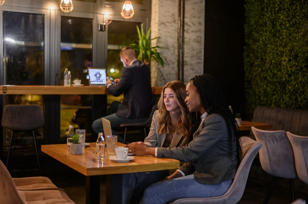 
two-businesswoman-having-a-meeting-in-a-cafe