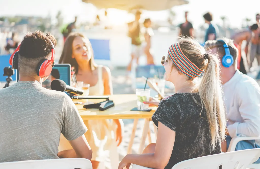 Group of people using devices at an outdoor café while connected to public Wi-Fi, highlighting CCPA considerations for shared Wi-Fi networks