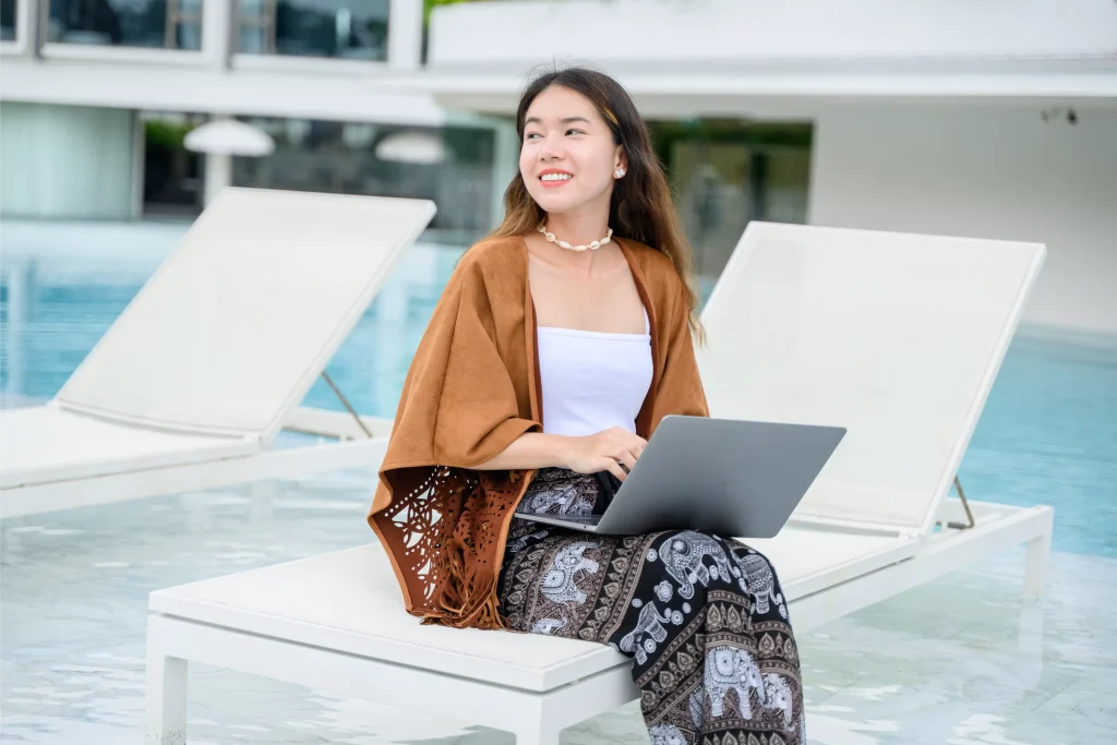 Guest using hotel Wi-Fi monetization features while working outdoors at a hotel