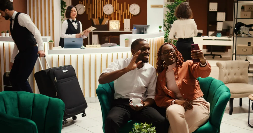 Hotel guests attending a video conference in the lobby using secure guest Wi-Fi