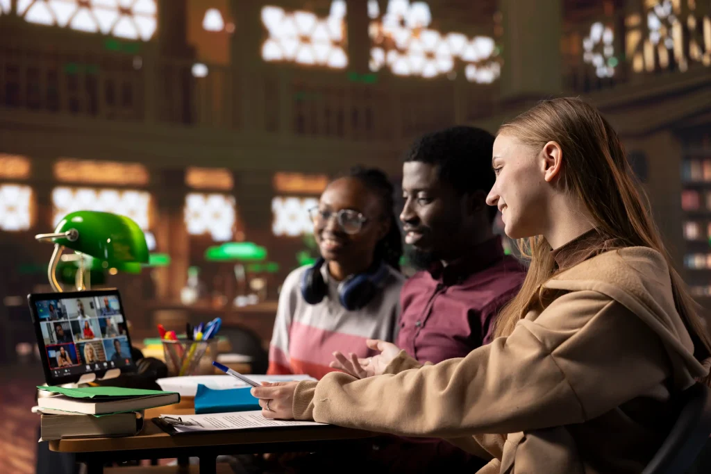 Students using multiple devices on a shared Wi-Fi network of a university, showing managed Wi-Fi access in a collaborative environment