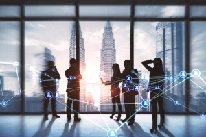 Business professionals standing in modern office building with digital network connections representing smart building WiFi management and connected workplace technology